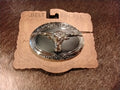 Steer head belt buckle with silver and black