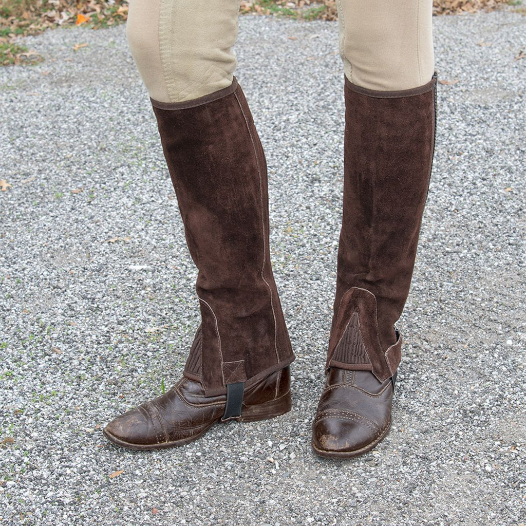 Showing suede half chaps on over boots