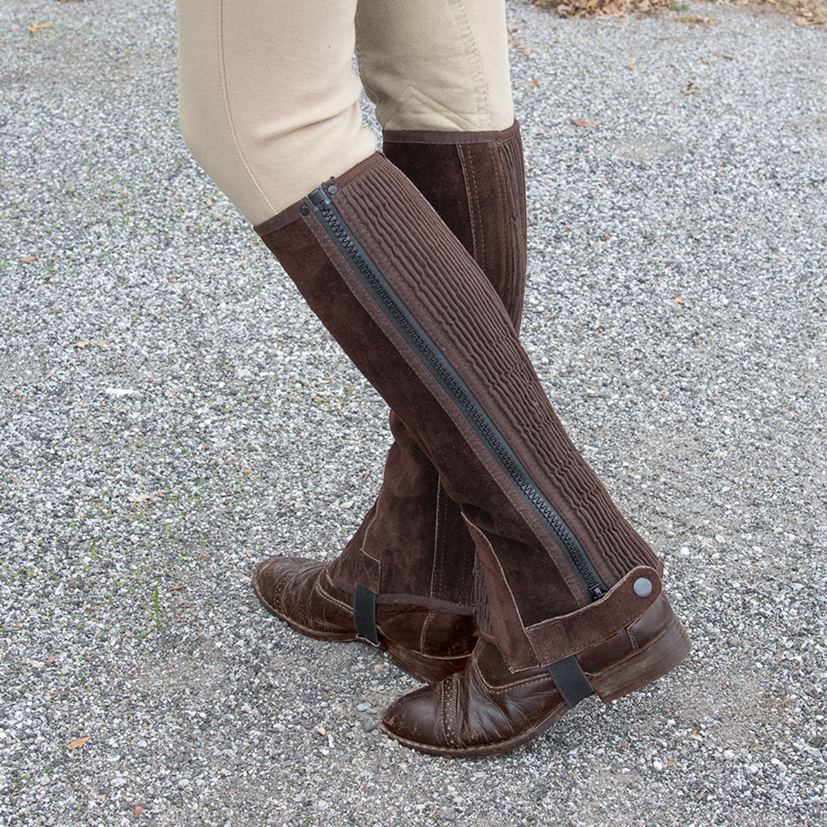 Showing how the suede half chaps fit to the leg