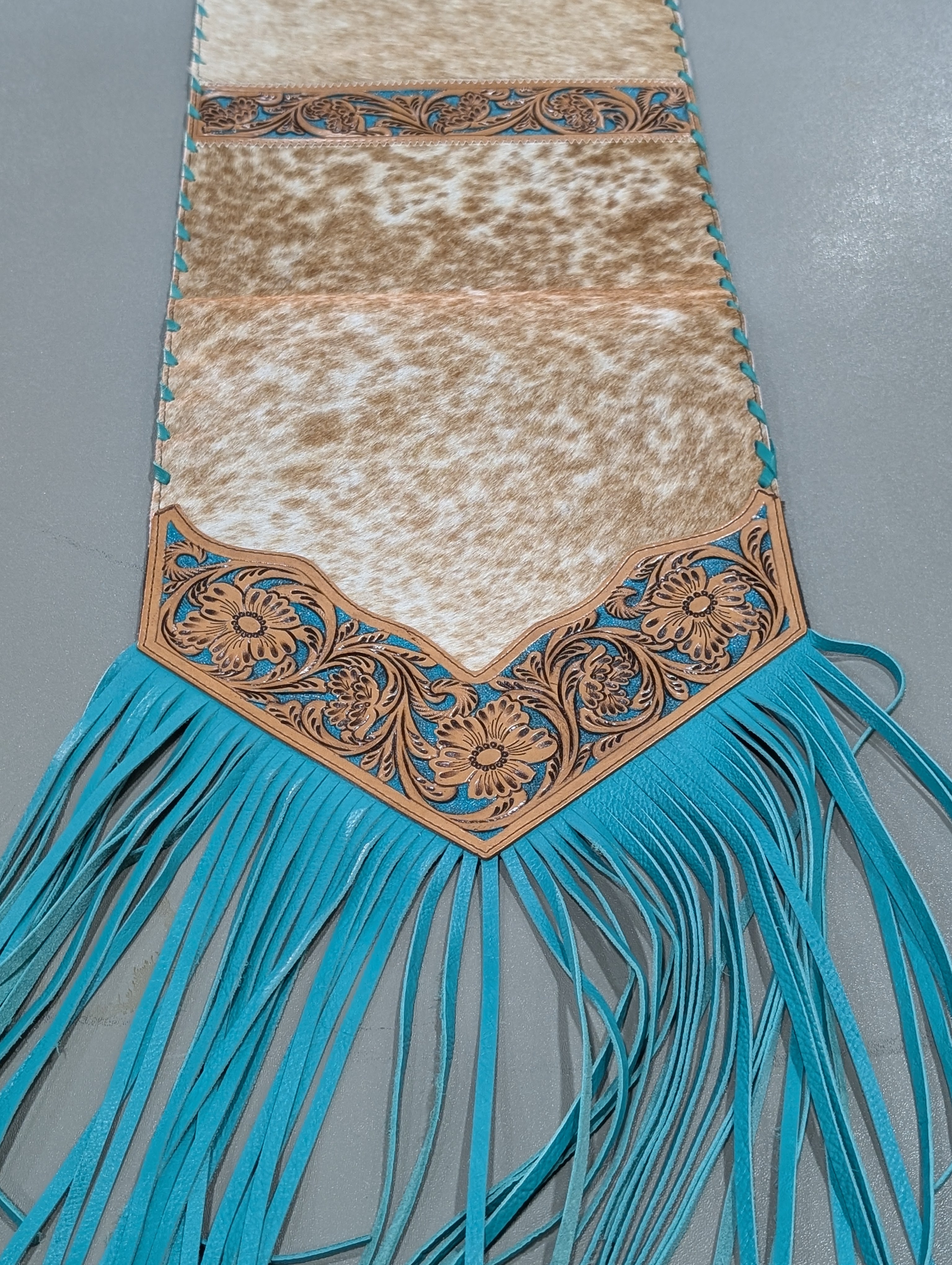 6ft genuine cowhide leather table runner with teal fringe and tooled leather ends