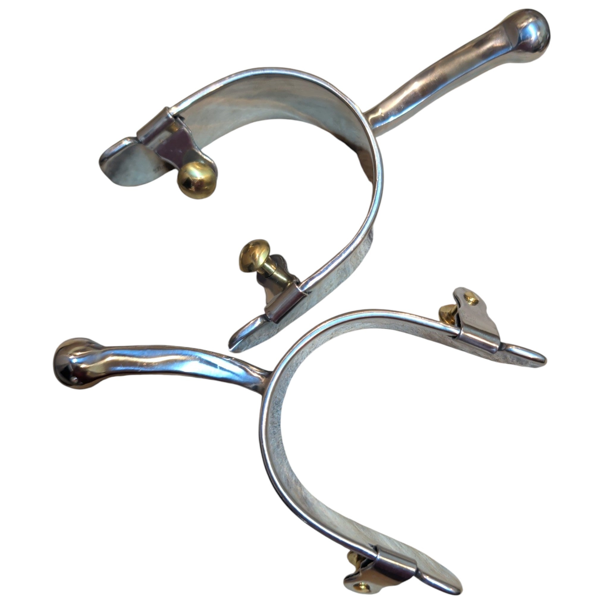 A pair of Tough 1 stainless steel equitation style spurs with a humane ball end rather than a rowel shown from the top.