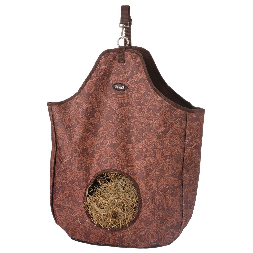 Tough 1 Heavy Nylon Hay bag tote in a brown floral print with a strap and snap on the top and a hole for the horse to eat the hay from.