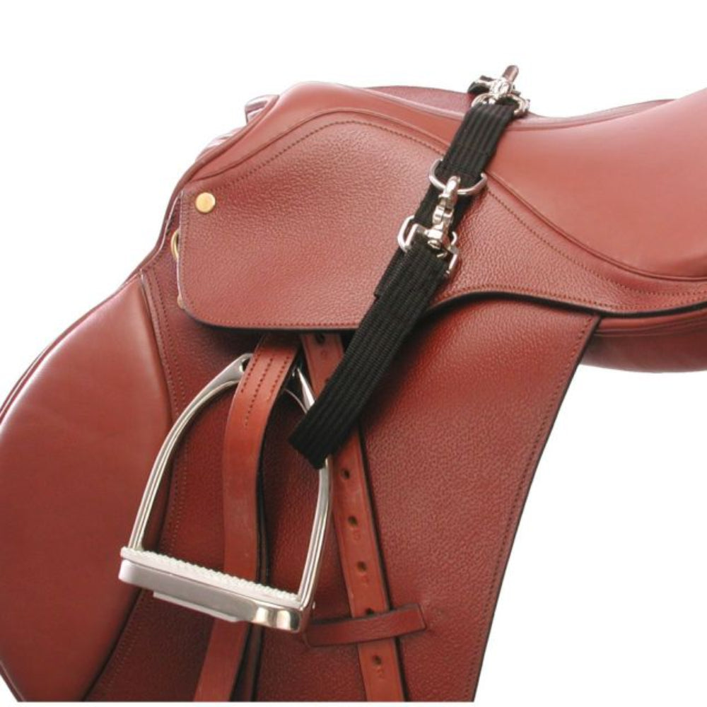 A close-up of a brown leather equestrian saddle with a black no bounce strap and silver metal stirrup.