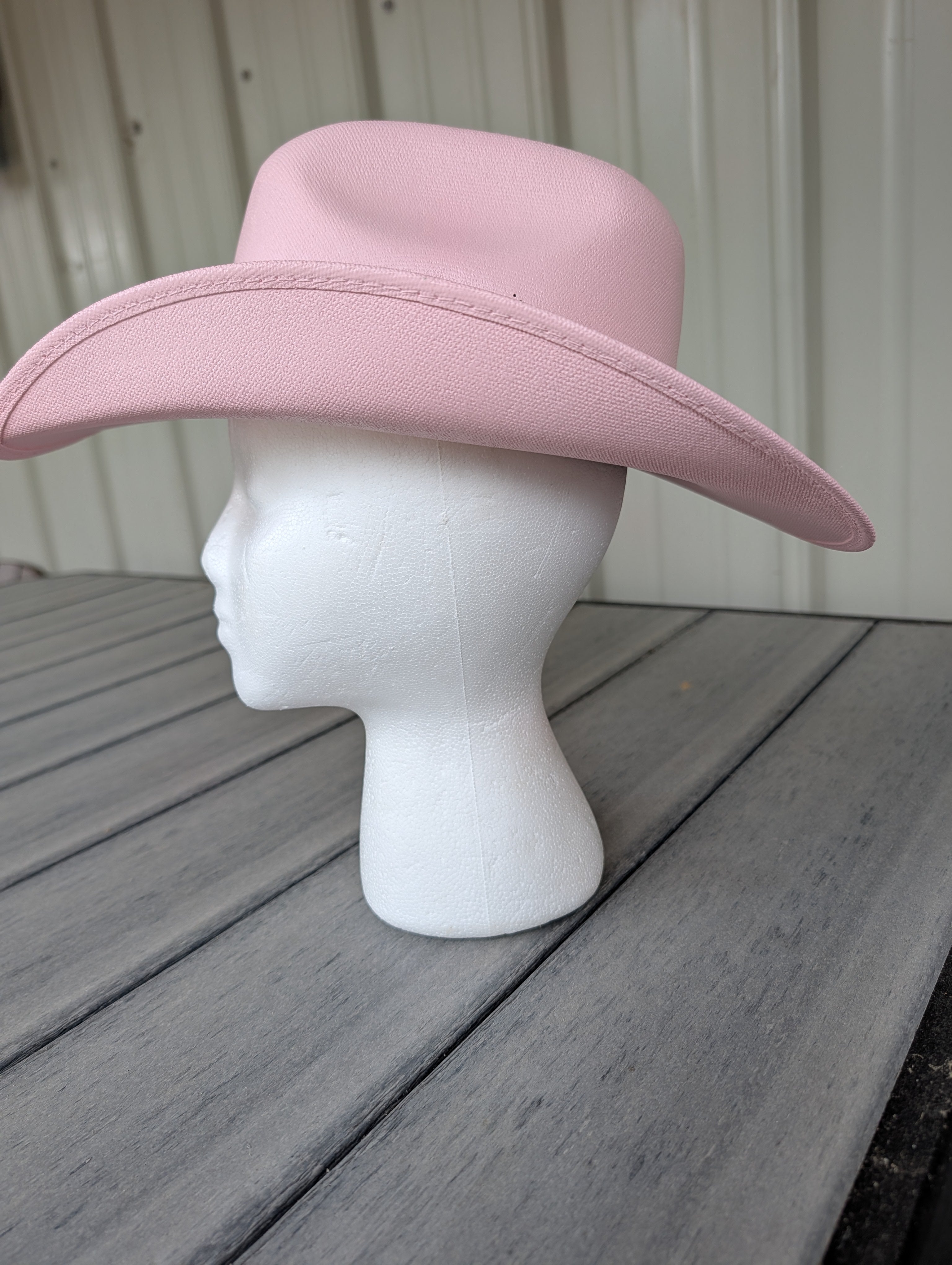 Side view of a pink cowgirl western kids hat.